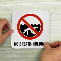 Pool safety signage against breath-holding